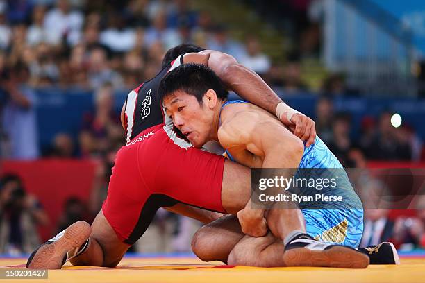 Tatsuhiro Yonemitsu of Japan in action against against Sushil Kumar of India during the Men's Freestyle 66 kg Wrestling gold medal fight on Day 16 of...