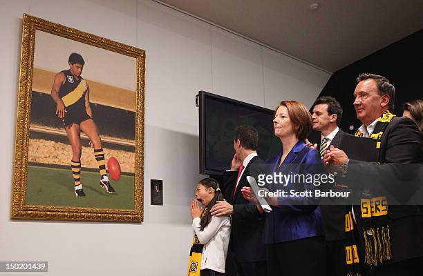 Australian Prime Minister Julia Gillard and her partner Tim Mathieson look on during the launch of the Korin Gamadji Institute at the ME Bank Centre...