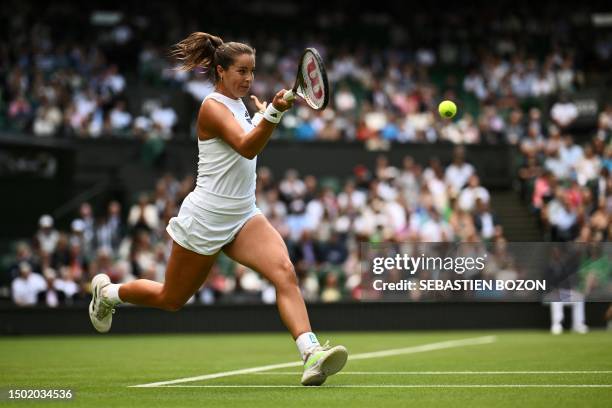 Britain's Jodie Burrage returns the ball to Russia's Daria Kasatkina during their women's singles tennis match on the third day of the 2023 Wimbledon...