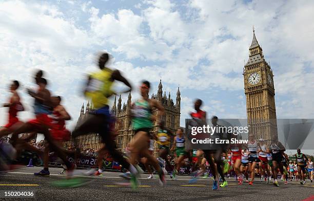 Athletes pass the Palace of Westminster as they compete in the Men's Marathon on Day 16 of the London 2012 Olympic Games on the streets of London on...