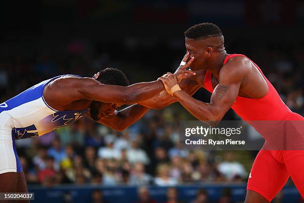 Livan Lopez Azcuy of Cuba in action against Haislan Veranes Garcia of Canada during the Men's Freestyle 66 kg Wrestling repechage fight on Day 16 of...