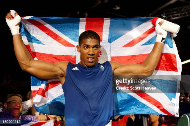 Anthony Joshua of Great Britain celebrates defeating Roberto Cammarelle of Italy to win the Men's Super Heavy Boxing final bout on Day 16 of the...
