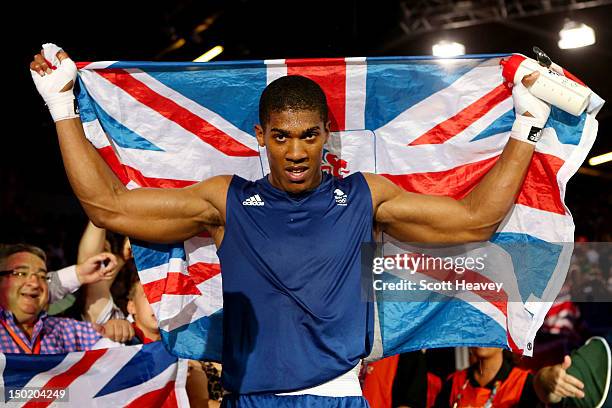 Anthony Joshua of Great Britain celebrates defeating Roberto Cammarelle of Italy to win the Men's Super Heavy Boxing final bout on Day 16 of the...