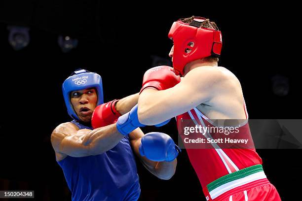 Anthony Joshua of Great Britain exchanges punches with Roberto Cammarelle of Italy during the Men's Super Heavy Boxing final bout on Day 16 of the...