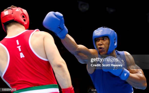 Anthony Joshua of Great Britain throws a punches against Roberto Cammarelle of Italy during the Men's Super Heavy Boxing final bout on Day 16 of the...