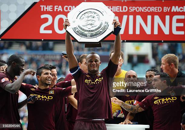 Vincent Kompany of Manchester City lifts the trophy during the FA Community Shield match between Manchester City and Chelsea at Villa Park on August...