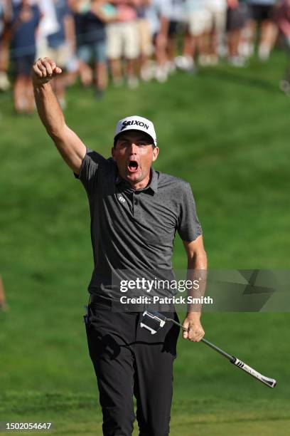 Keegan Bradley of the United States celebrates after winning on the 18th green during the final round of the Travelers Championship at TPC River...