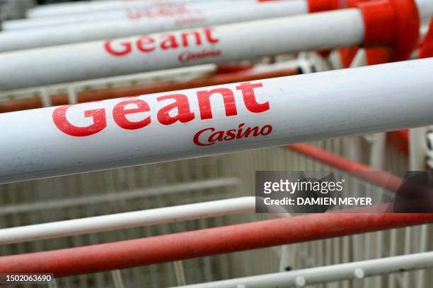 This photograph shows the logo of Casino on a supermaket trolley close to a Casino shop in Ploubalay, western France on July 5, 2023. Their...
