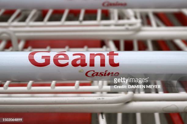This photograph shows the logo of Casino on a supermaket trolley close to a Casino shop in Ploubalay, western France on July 5, 2023. Their...