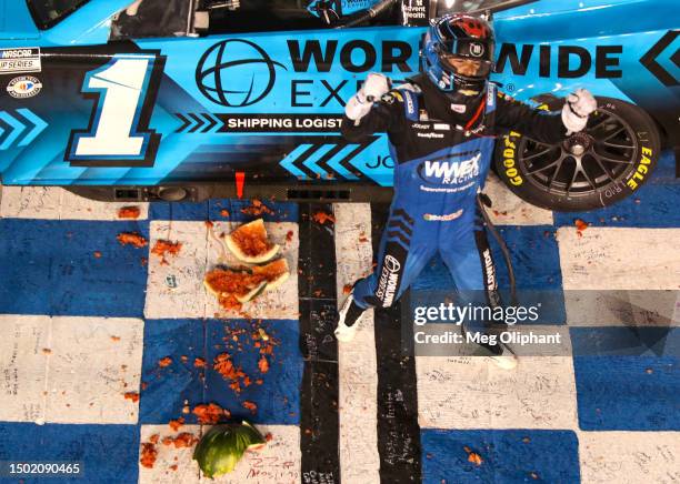 Ross Chastain, driver of the Worldwide Express Chevrolet, celebrates after winning the NASCAR Cup Series Ally 400 at Nashville Superspeedway on June...