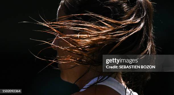 Britain's Jodie Burrage reacts as she returns the ball to Russia's Daria Kasatkina during their women's singles tennis match on the third day of the...