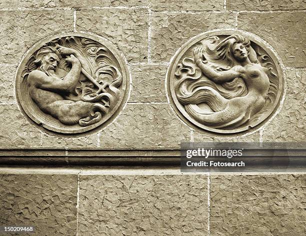 stone wall with carved out mermaid and poseidon at santa barbara courthouse - poseidon sculpture 個照片及圖片檔