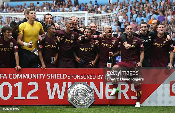 Manchester City celebrate after their victory during the FA Community Shield match between Manchester City and Chelsea at Villa Park on August 12,...
