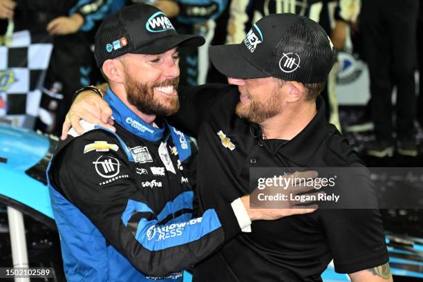 Ross Chastain, driver of the Worldwide Express Chevrolet, is congratulated by Trackhouse Racing team co-owner, Justin Marks in victory lane after...
