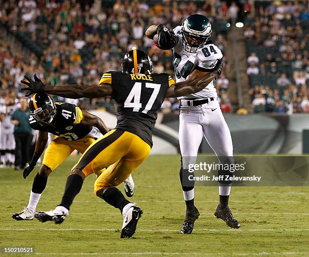 Jamel Hamler of the Philadelphia Eagles runs by Myron Rolle of the Pittsburgh Steelers during a preseason game at Lincoln Financial Field on August...