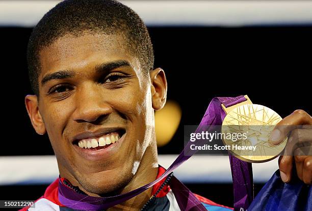 Gold medalist Anthony Joshua of Great Britain celebrates after the medal ceremony for the Men's Super Heavy Boxing final bout on Day 16 of the London...