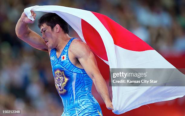 Tatsuhiro Yonemitsu of Japan celebrated at winning the gold medal by defeating Sushil Kumar of India in the gold medal match of the men's 96kg...