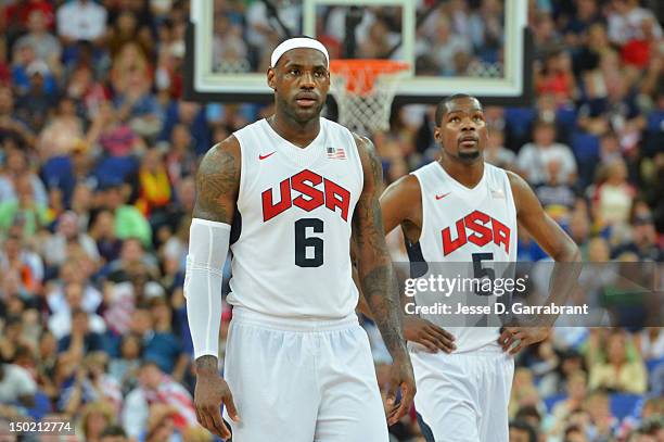 LeBron James and Kevin Durant of the US Men's Senior Nation Team looks on against Spain during their Men's Gold Medal Basketball Game on Day 16 of...