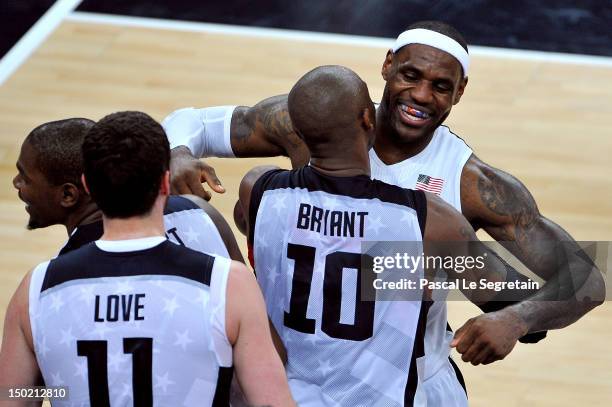 LeBron James of the United States celebrates winning the Men's Basketball gold medal game between the United States and Spain with teasm mate Kobe...