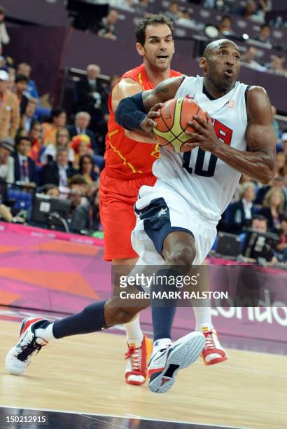 Spanish guard Jose Calderon challenges US guard Kobe Bryant during the London 2012 Olympic Games men's gold medal basketball game between USA and...