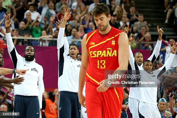 The United States bench celebrate as Marc Gasol of Spain shows his emotion in the Men's Basketball gold medal game between the United States and...