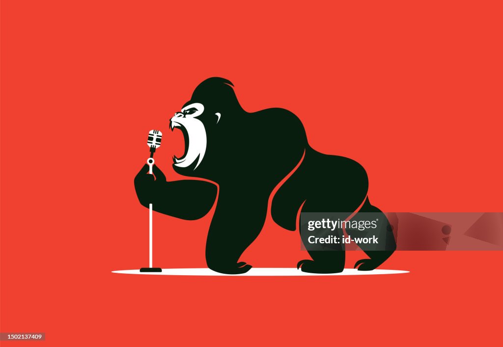 Gorilla hält Mikrofon und brüllt