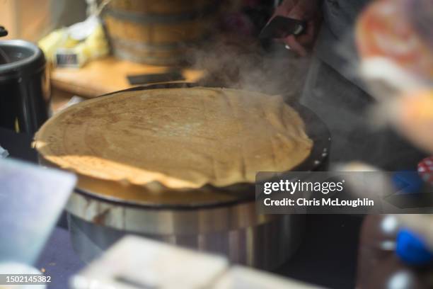 street food. making a french crepe - calvados stock pictures, royalty-free photos & images