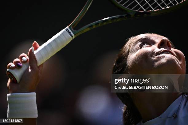 Britain's Jodie Burrage serves the ball to Russia's Daria Kasatkina during their women's singles tennis match on the third day of the 2023 Wimbledon...