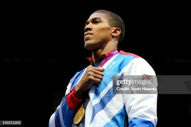 Gold medalist Anthony Joshua of Great Britain celebrates on the podium during the medal ceremony for the Men's Super Heavy Boxing final bout on Day...