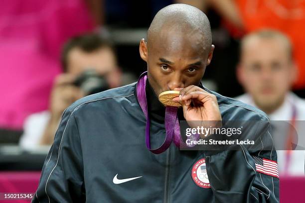 Gold medallist Kobe Bryant of the United States celebrates on the podium during the medal ceremony for the Men's Basketball on Day 16 of the London...