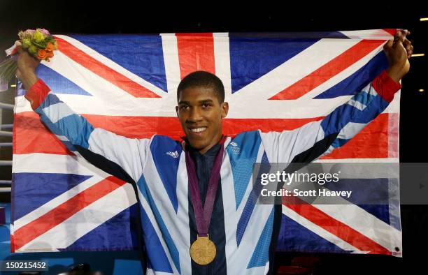 Gold medalist Anthony Joshua of Great Britain celebrates after the medal ceremony for the Men's Super Heavy Boxing final bout on Day 16 of the London...