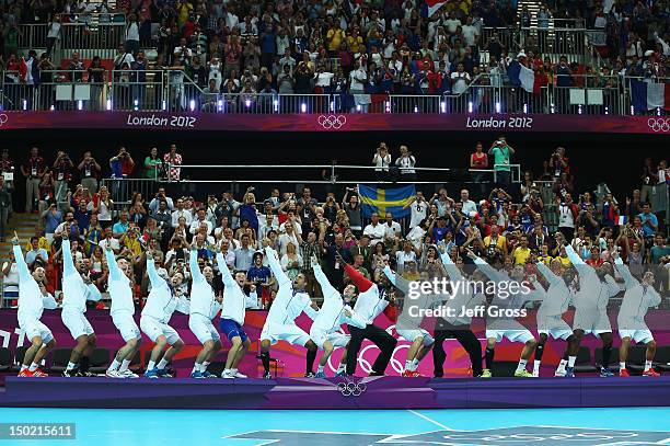 France celebrate on the podium after winning the gold medal against Sweden during the Men's Handball Gold Medal Match on Day 16 of the London 2012...