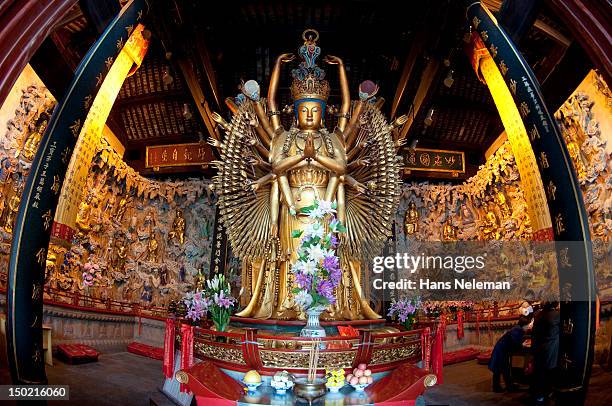 buddhist statue in longhua temple, shanghai - longhua temple stock-fotos und bilder