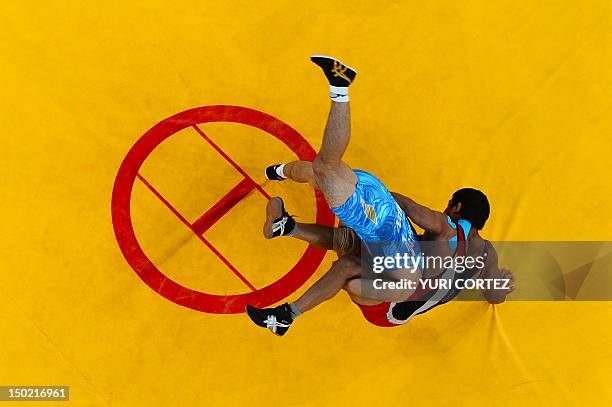 India's Sushil Kumar wrestles Japan's Tatsuhiro Yonemitsu in their Men's 66kg Freestyle gold medal match on August 12, 2012 during the wrestling...