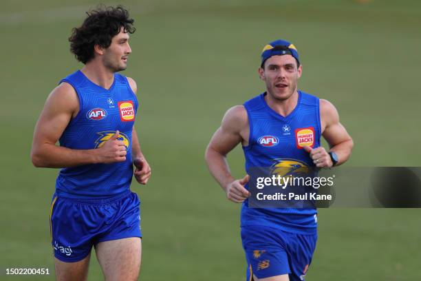 Tom Barrass and Luke Shuey jog laps during a West Coast Eagles AFL training session at Mineral Resources Park on June 26, 2023 in Perth, Australia.