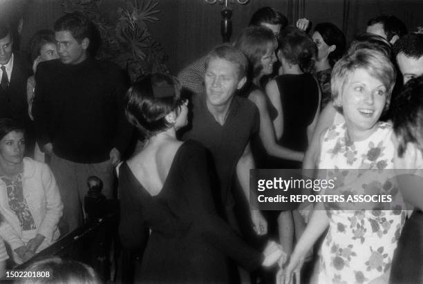Actor Steve McQueen dancing with his wife Neile Adams, in Paris, France, on September 17, 1964.