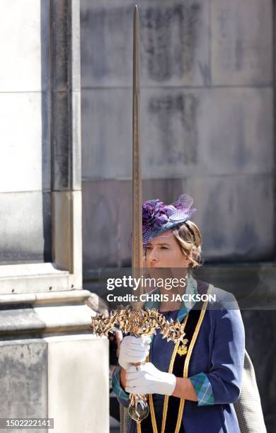 Katherine Grainger, bearer of the The Sword of State, the 'Elizabeth Sword' carries it into St Giles' Cathedral to attend a National Service of...