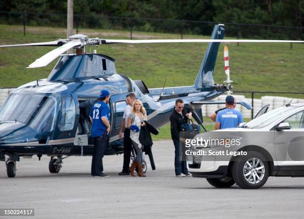 Carrie Underwood and husband Mike Fisher arrive at Boots and Hearts Festival on August 12, 2012 in Bowmanville, Canada.