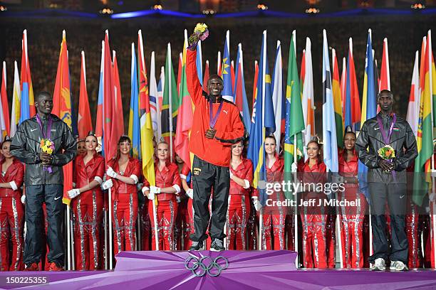 Silver medalist Abel Kirui of Kenya, gold medalist Stephen Kiprotich of Uganda and bronze medalist Wilson Kipsang Kiprotich of Kenya pose on the...