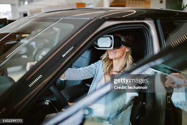 trying out the vr car features presentation - sports car showroom stock pictures, royalty-free photos & images
