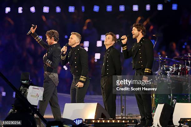 Jason Orange, Gary Barlow, Mark Owen and Howard Donald of Take That perform during the Closing Ceremony on Day 16 of the London 2012 Olympic Games at...