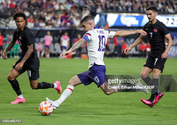 Christian Pulisic of the United States takes a shot as Tajon Buchanan and Stephen Eustaquio of Canada defend in the second half of the 2023 CONCACAF...