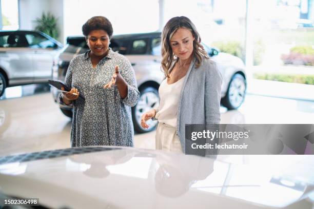 woman looking for a new car - luxury 4x4 stock pictures, royalty-free photos & images