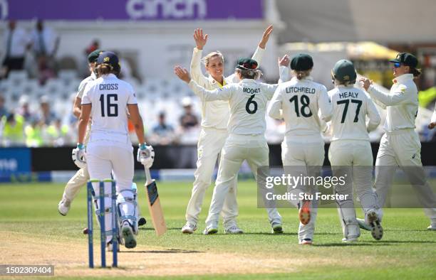 Australia bowler Ashleigh Gardner is congratulated by team mates after taking the wicket of Kate Cross during day five of the LV= Insurance Women's...