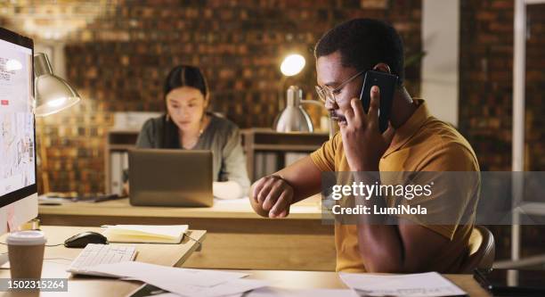time, late and a black man on a phone call at work for business, networking and deadline. talking, browsing and an african employee working overtime on a computer while speaking on a mobile at night - time stock pictures, royalty-free photos & images