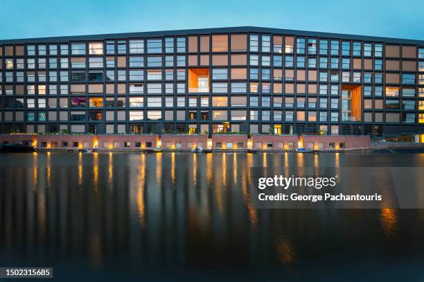 modern architecture reflection on water - amsterdam sunset stock pictures, royalty-free photos & images