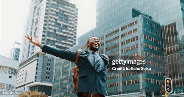 open arms, celebration and business man in a city happy, excited and winner on urban background. success, good news and african male winner cheerful for victory, accomplishment or job opportunity - enthusiastic stock pictures, royalty-free photos & images