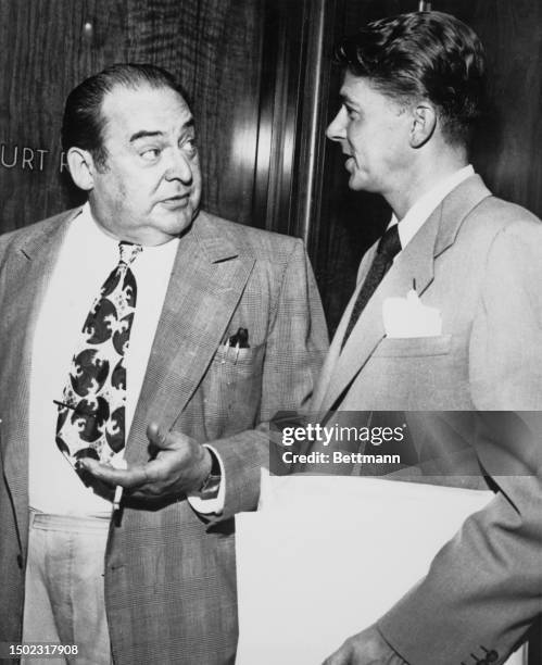 Actors Edward Arnold and Ronald Reagan , officers of the Screen Actors Guild, during talks about Hollywood film strikes, California, August 1947.