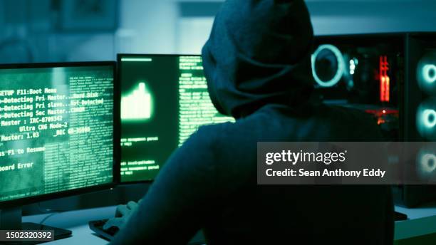 back of hacker, person and dark computer for cybersecurity, ransomware and data password for crime. error, thief and spy coding pc software for scam, phishing and hacking online firewall with malware - hacker stock pictures, royalty-free photos & images