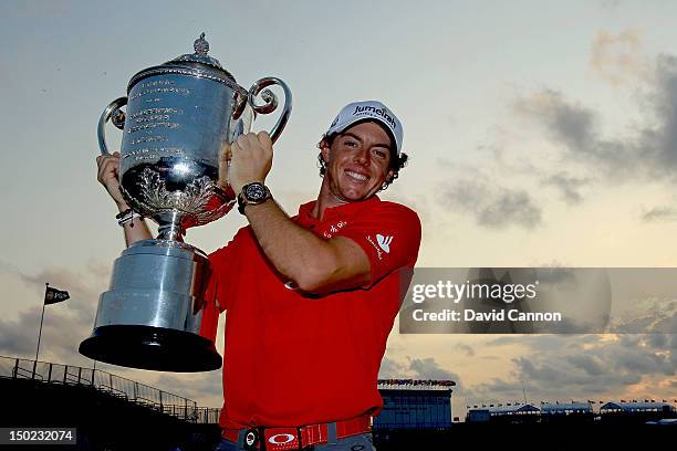 Rory McIlroy of Northern Ireland holds up the Wanamaker Trophy after winning the 94th PGA Championship at the Ocean Course on August 12, 2012 in...